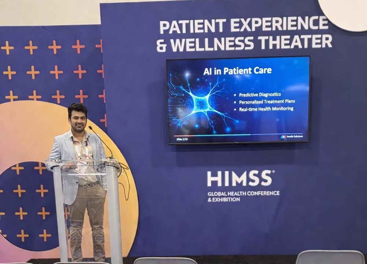 Girish speaking at an event